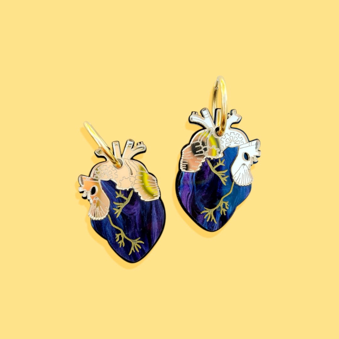 Pendientes corazones galaxia dorado - Annie's Fingers